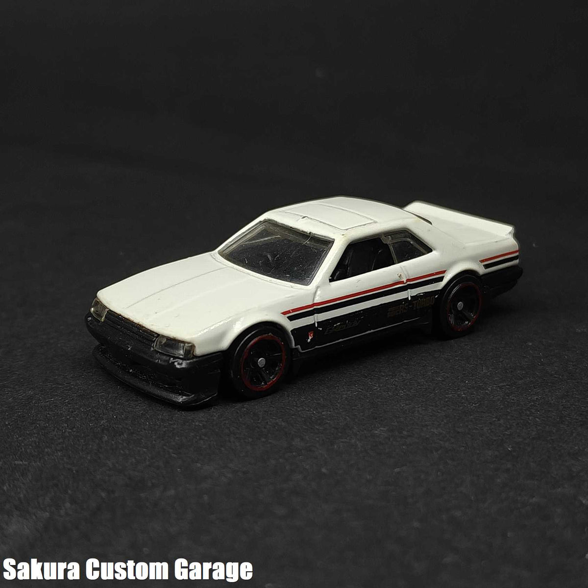 Hot Wheels - Nissan Skyline RS KDR30 (2019) 1/10 Nightburnerz 048/250